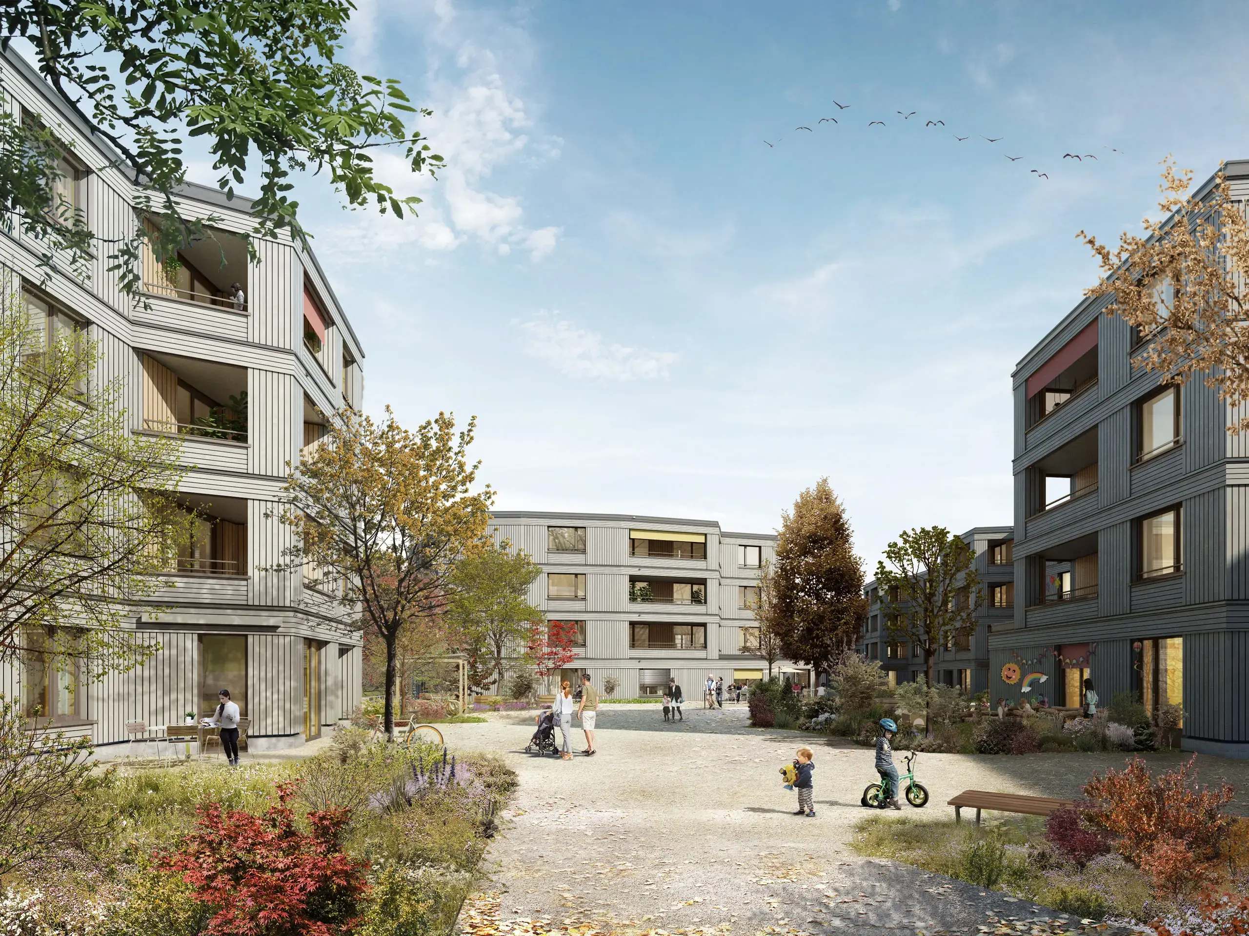 Wohnüberbauung Papillon in Köniz mit Holzfassaden und Innenhof
